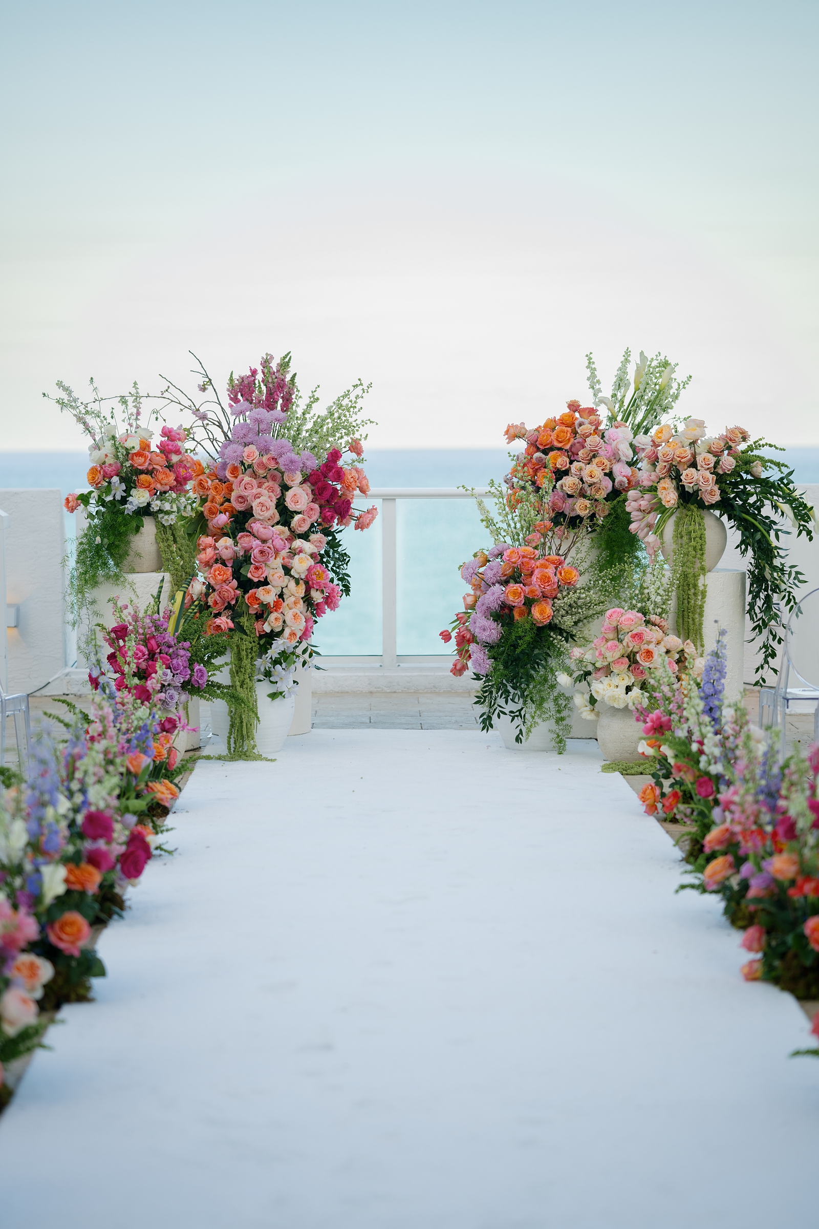 Conrad Fort Lauderdale Beach ballroom wedding — oversized tree installation in white sculptural urn with cascading pink blossoms | Sunny Lee Photography